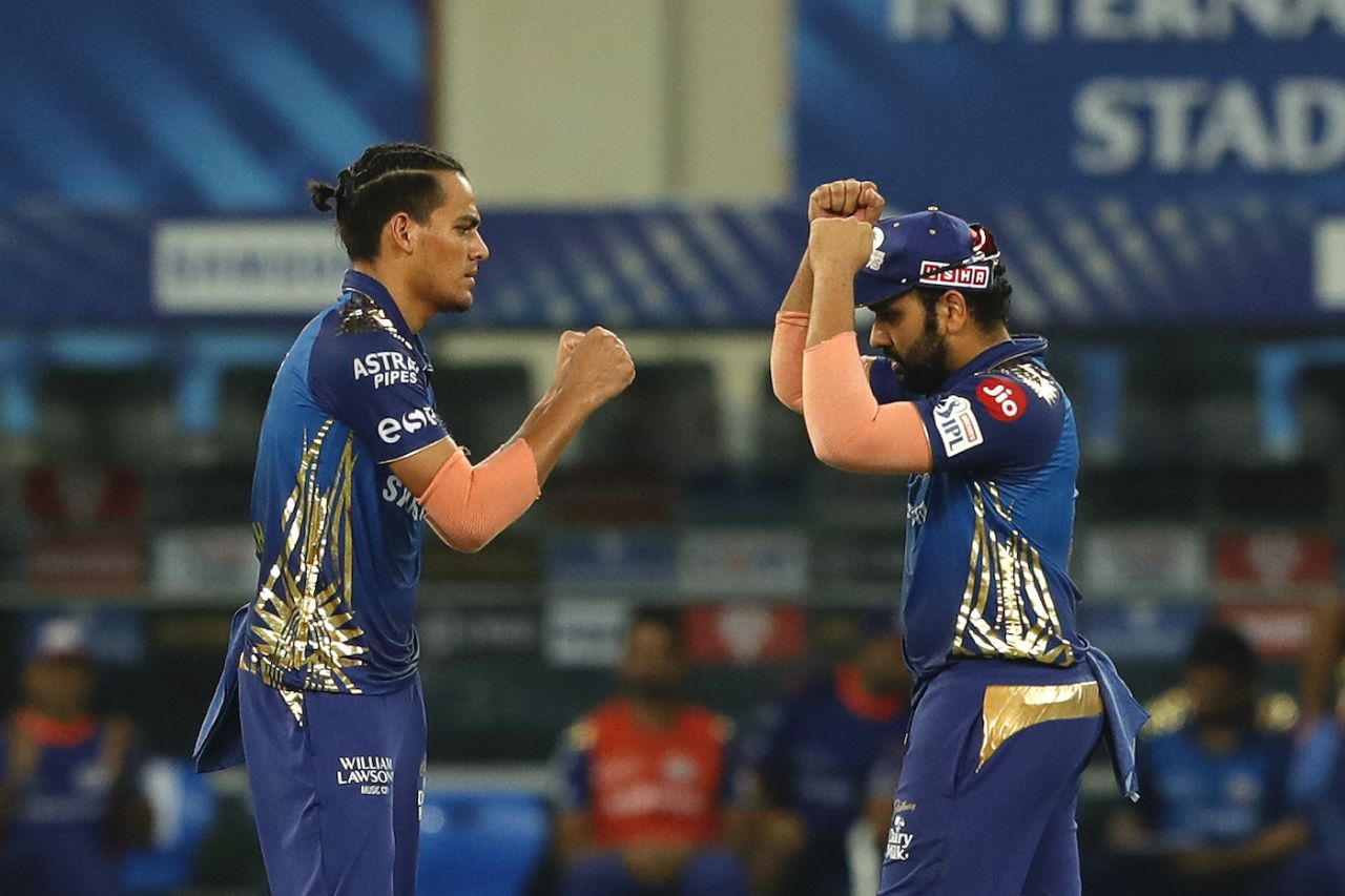 Rahul Chahar celebrates with Rohit Sharma after dismissing Virat Kohli cheaply, Mumbai Indians v Royal Challengers Bangalore, IPL 2020, Dubai, September 28, 2020