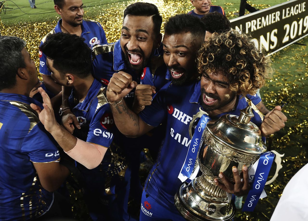 Lasith Malinga holds the IPL trophy and celebrates with Krunal and Hardik Pandya, Mumbai Indians v Chennai Super Kings, IPL 2019 final, Hyderabad, May 12, 2019