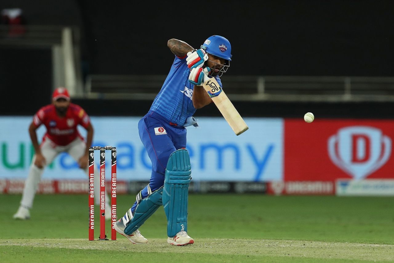 Shikhar Dhawan  punches one down the ground, Delhi Capitals vs Kings XI Punjab, IPL 2020, Dubai, October 20, 2020