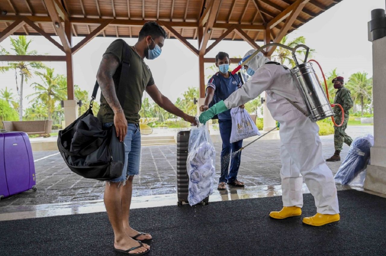Kusal Mendis collects a package from a PPE-clad hotel staff, LPL 2020, Hambantota, November 22, 2020