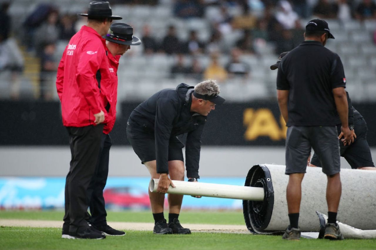The ground staff put on the covers after rain interrupted the match, New Zealand vs West Indies, 1st T20I, Auckland, November 27, 2020