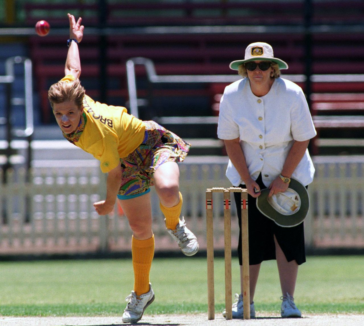 Joanne Broadbent sends one down, watched by umpire Senator Cheryl Kernot, Super 8 Celebrity Match, North Sydney Oval, November 12, 1996