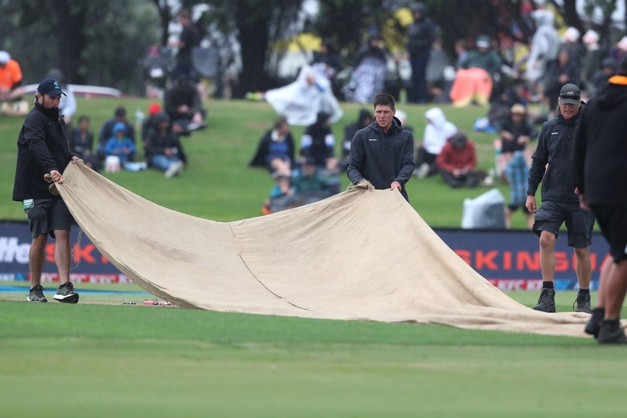 The ground staff cover the pitch after the match was interrupted by rain, New Zealand vs West Indies, 2nd T20I, Mount Maunganui, November 29, 2020