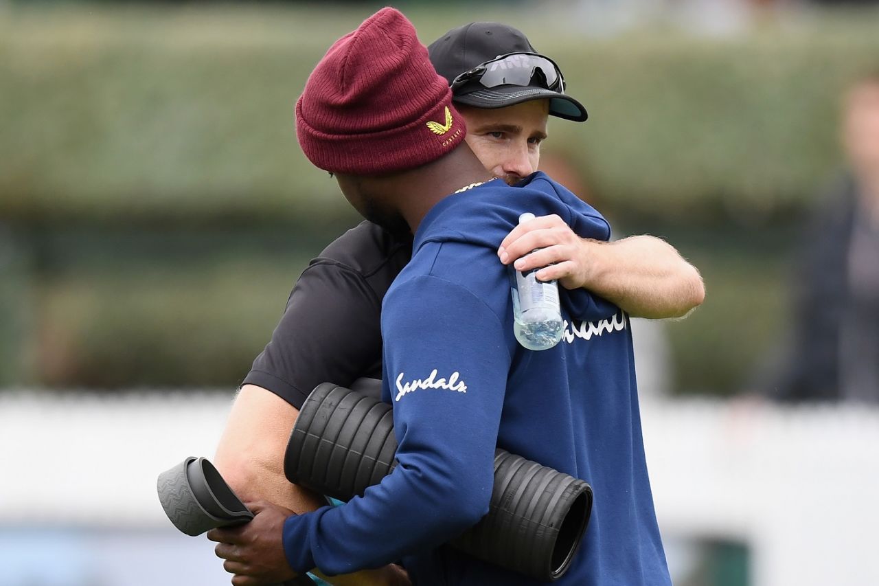 Kemar Roach, seen here getting a hug from Kane Williamson, lost his father in the 48 hours before the match, New Zealand vs West Indies, 1st Test, Hamilton, 1st day, December 3, 2020 