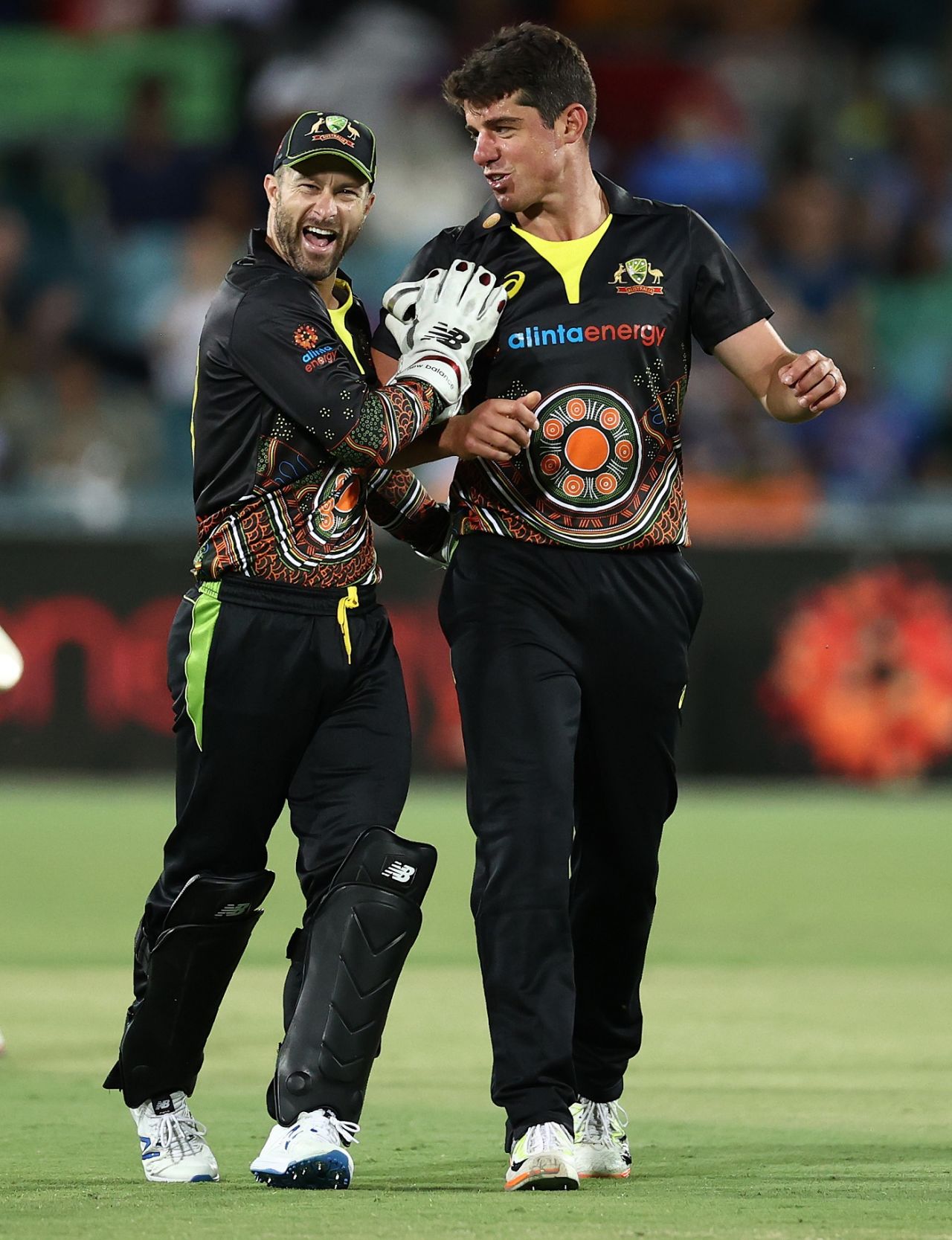 Moises Henriques celebrates a wicket with Matthew Wade, Australia vs India, 1st T20I, Canberra, December 4, 2020