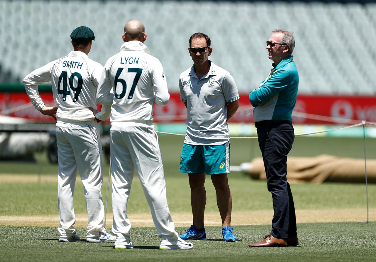 Justin Langer and national selector Trevor Hohns chat with Steven Smith and Nathan Lyon, Adelaide, December 15, 2020