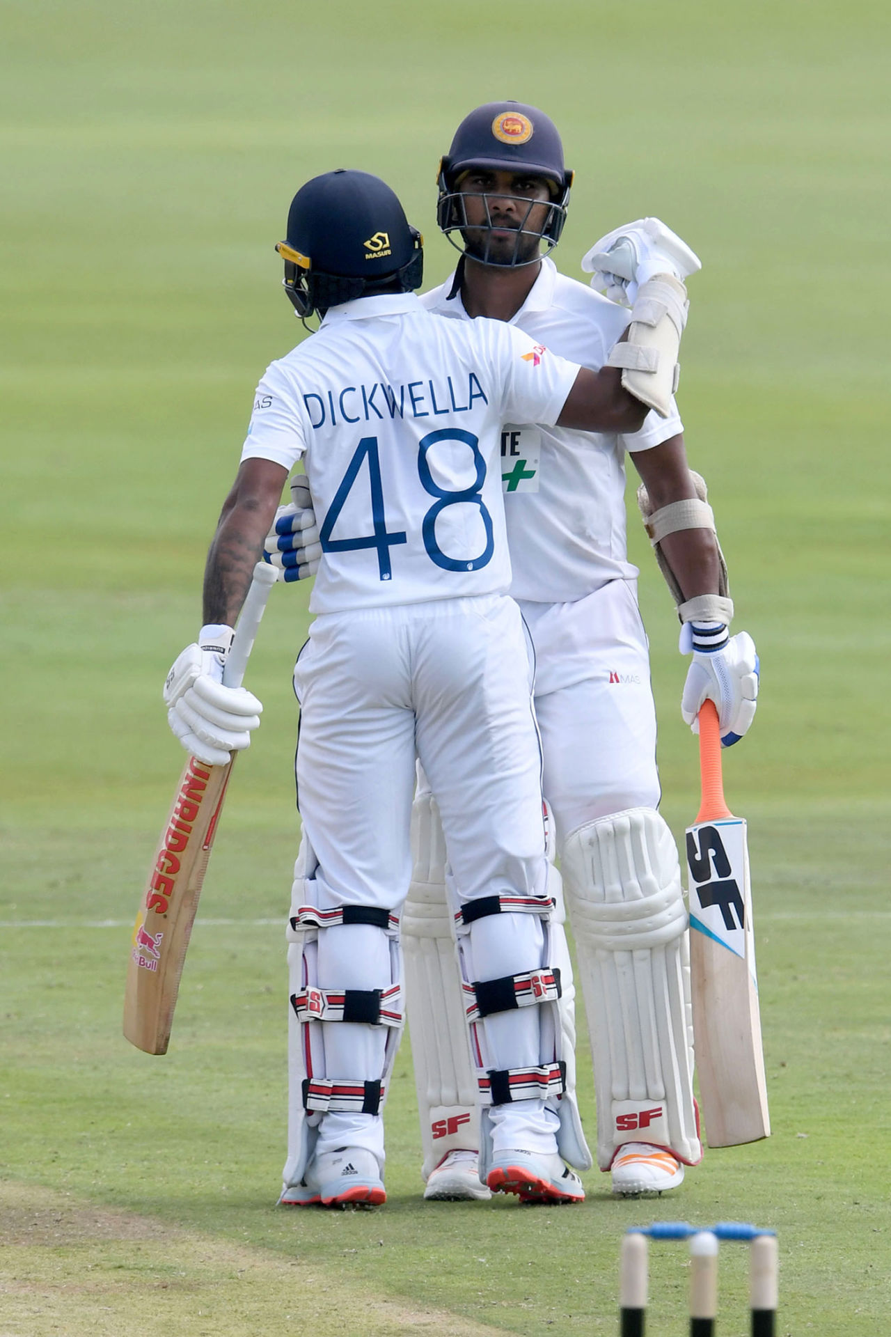 Dinesh Chandimal is congratulated by Niroshan Dickwella for his half-century, South Africa v Sri Lanka, 1st Test, Centurion, December 26, 2020