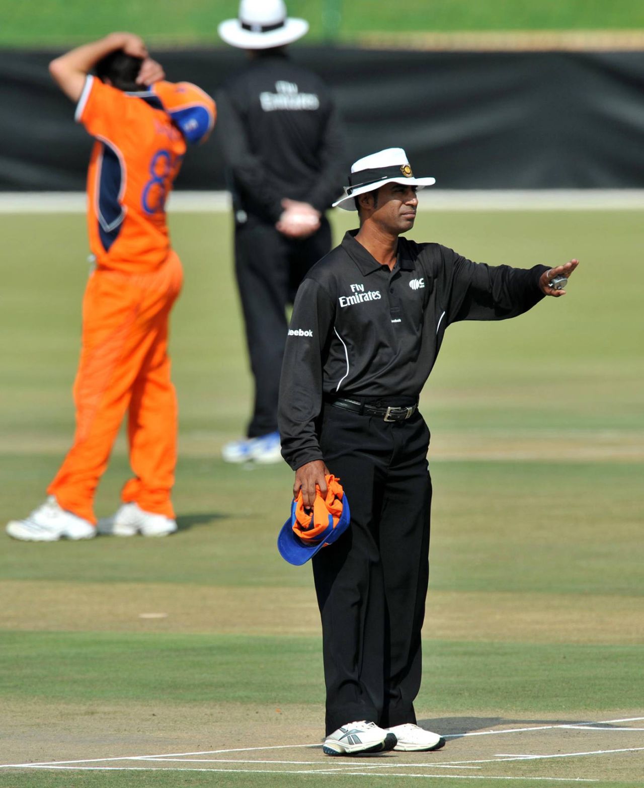Umpire Enamul Haque Moni signals a four, Kenya v Netherlands, ICC World Cup Qualifiers, Potchefstroom, April 1, 2009