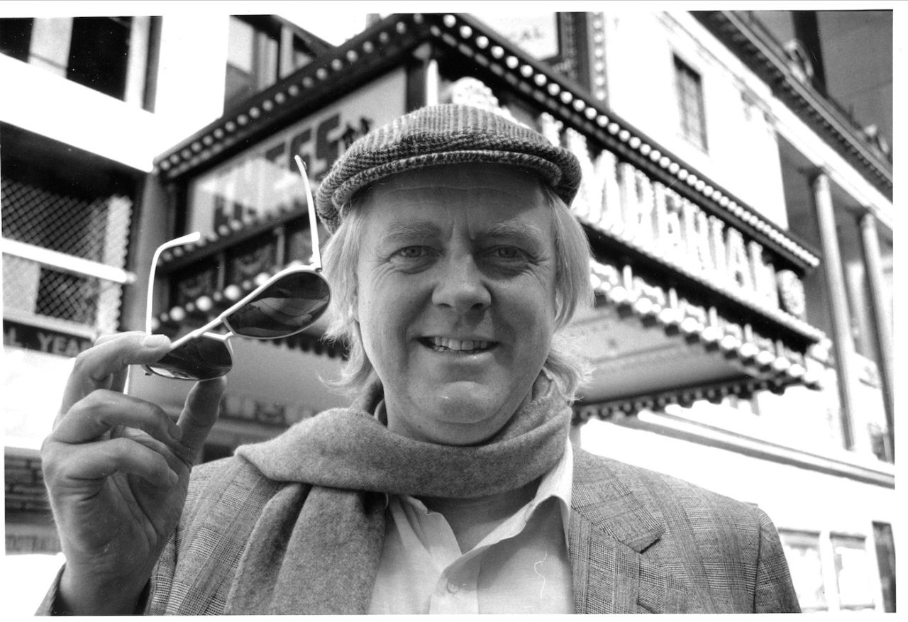 Tim Rice, lyricist for the musical Chess, poses in front of the show marquee at the Imperial Theatre, New York City, April 5, 1988