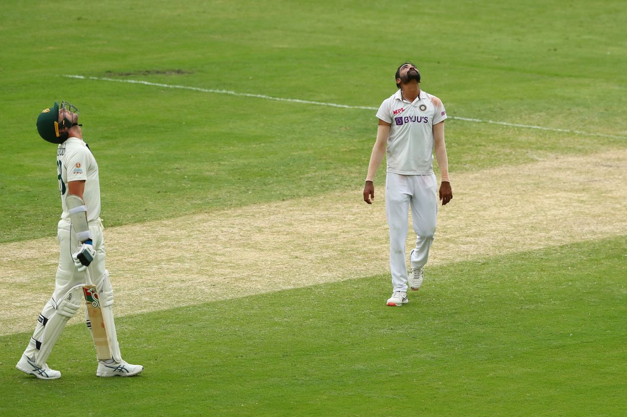 Josh Hazlewood and Mohammed Siraj look up to the heavens - for contrasting reasons though - after Hazlewood became Siraj's fifth wicket, Australia vs India, 4th Test, Brisbane, 4th day, January 18, 2021