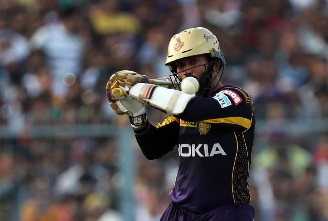 Dinesh Karthik gets into position to play a ramp shot, Kolkata, April 21, 2018