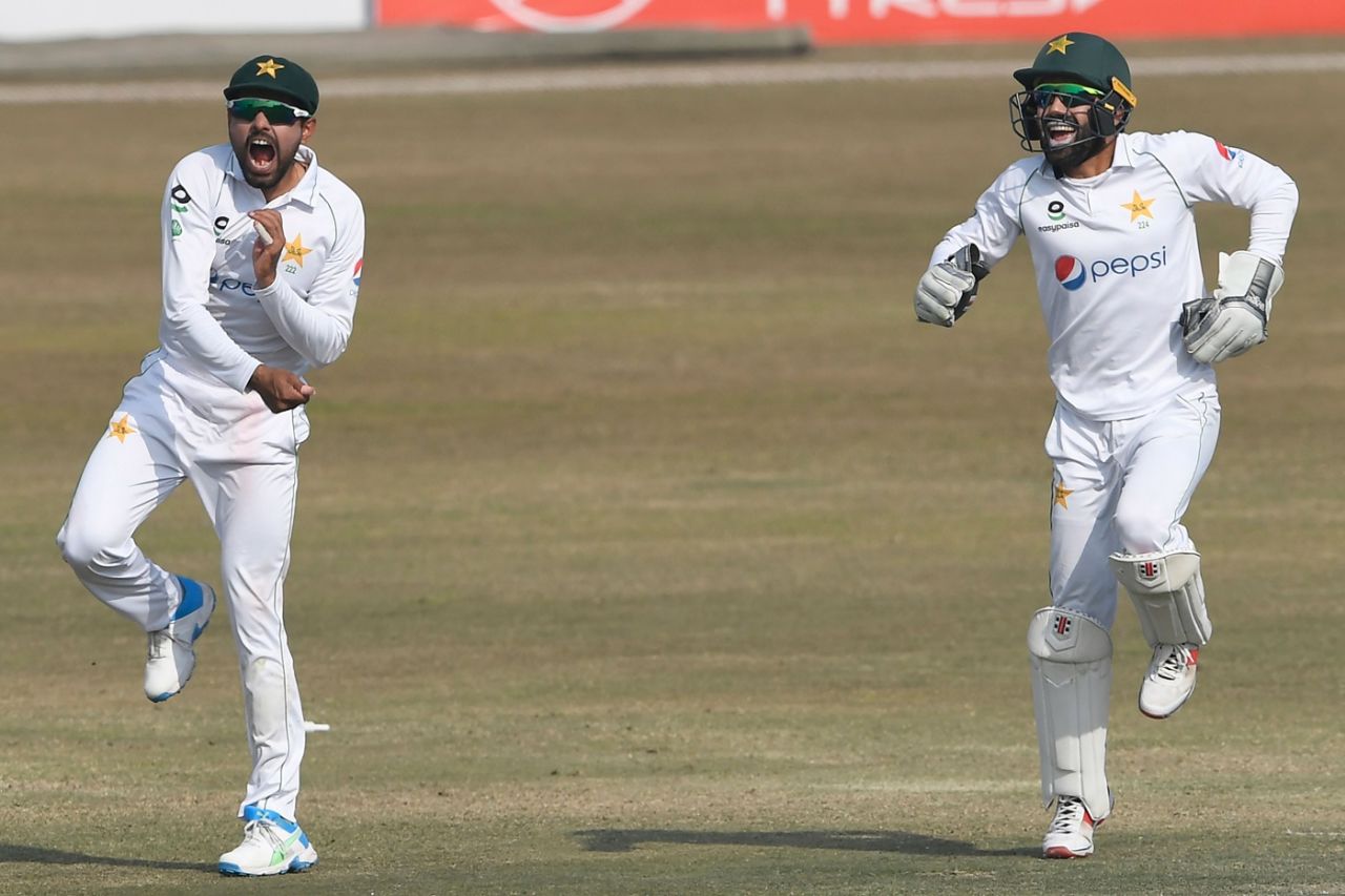 Pakistan captain Babar Azam (L) and team-mate Mohammad Rizwan (R) celebrate their win, Pakistan vs South Africa, 2nd Test, Rawalpindi, 5th day, February 8, 2021
