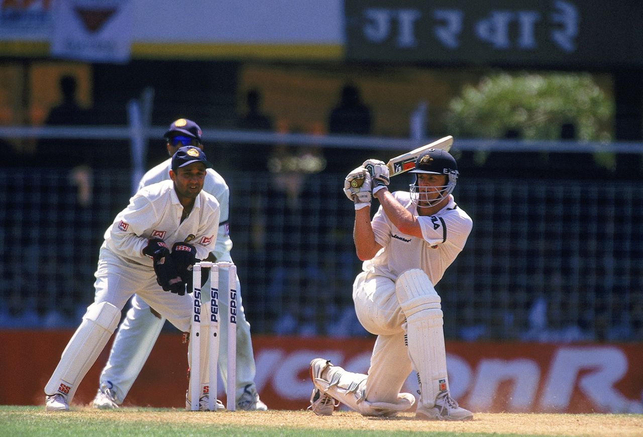 Adam Gilchrist sweeps on his way to 122, India v Australia, 2nd day, Mumbai, February 28, 2001