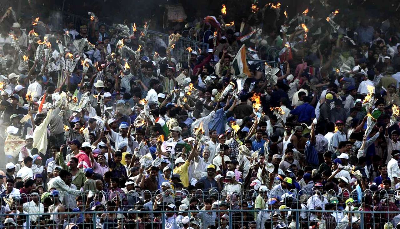 Spectators celebrate India's win by lighting newspapers on fire, India v Australia, 5th day, 2nd Test, Kolkata, March 15, 2001
