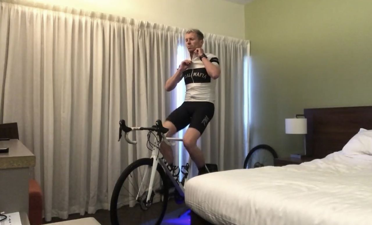 Peter Siddle exercises on a stationary bike in his hotel room during a quarantine after travelling from Melbourne ahead of joining the Tasmania state squad, Hobart, July 29, 2020