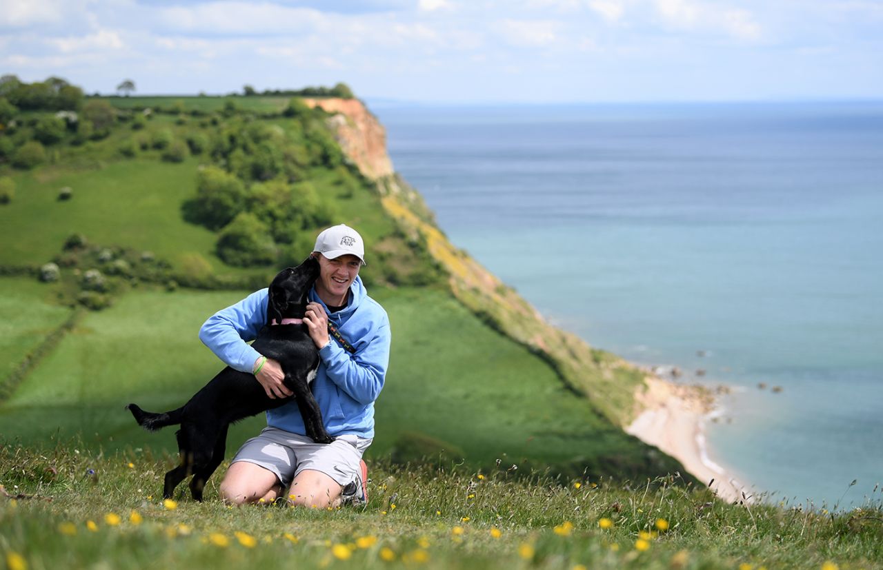 Dom Bess walking his parents' dog, Tilly, during the coronavirus lockdown, Shipton, England, May 13, 2020