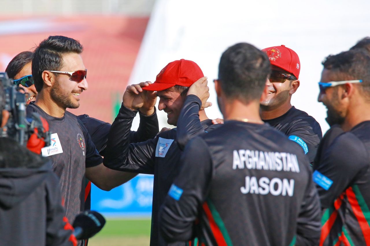 Rahmat hands over the cap to debutant Munir Ahmad, Afghanistan vs Zimbabwe, 1st Test, Abu Dhabi, 1st day, March 2, 2021