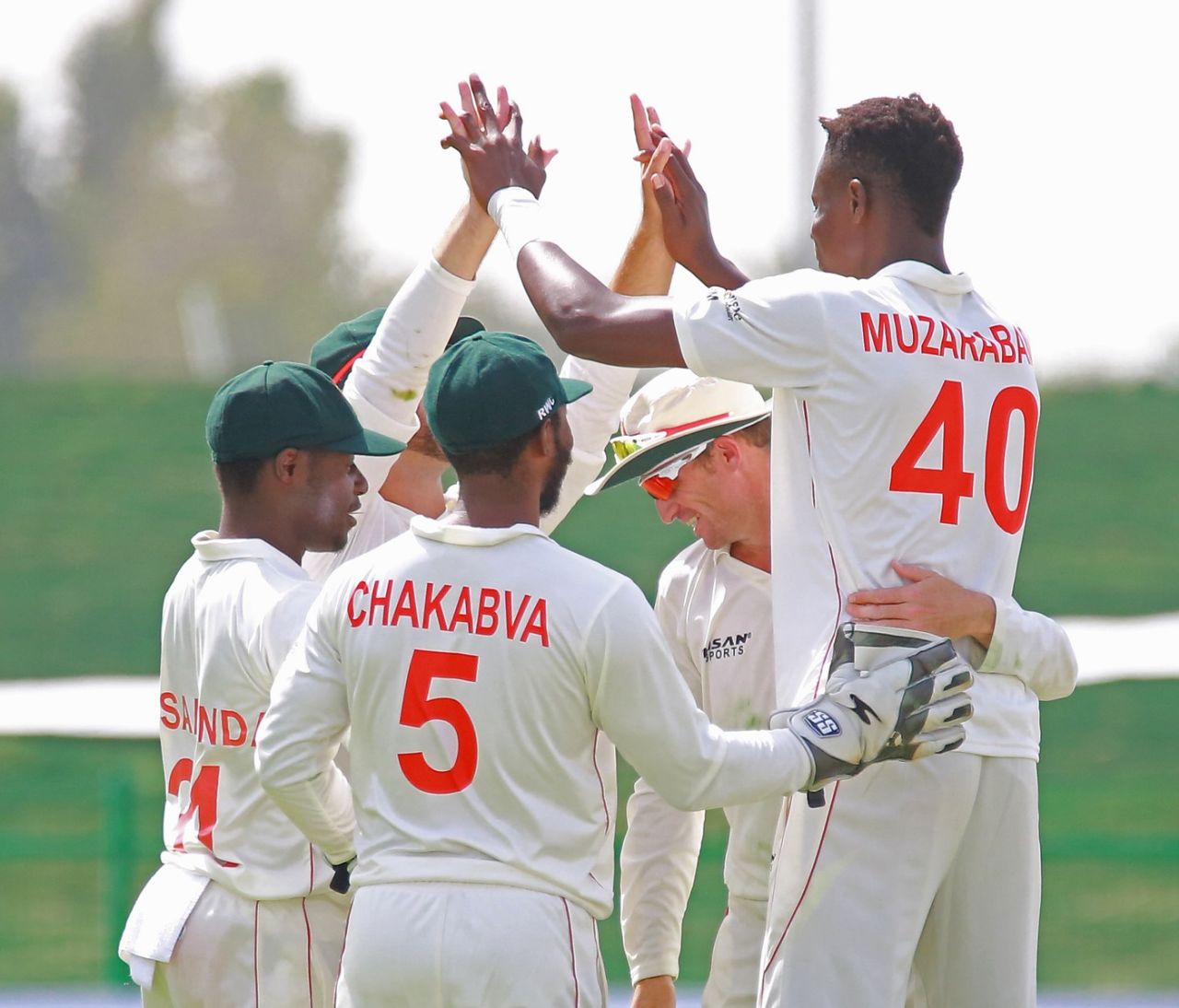 Blessing Muzarabani celebrates a wicket with his team-mates, Afghanistan vs Zimbabwe, 1st Test, Abu Dhabi, 1st day, March 2, 2021