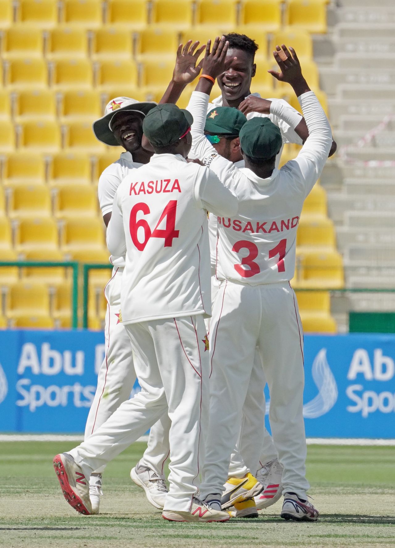 Blessing Muzarabani celebrates a wicket with his team-mates, Afghanistan vs Zimbabwe, 1st Test, Abu Dhabi, 2nd day, March 3, 2021