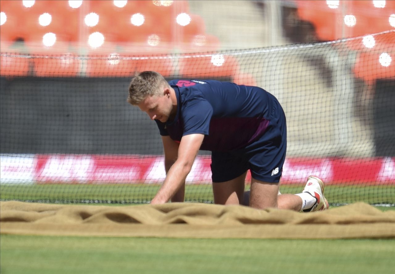 Joe Root has a close look at the Ahmedabad pitch, Ahmedabad, March 3, 2021