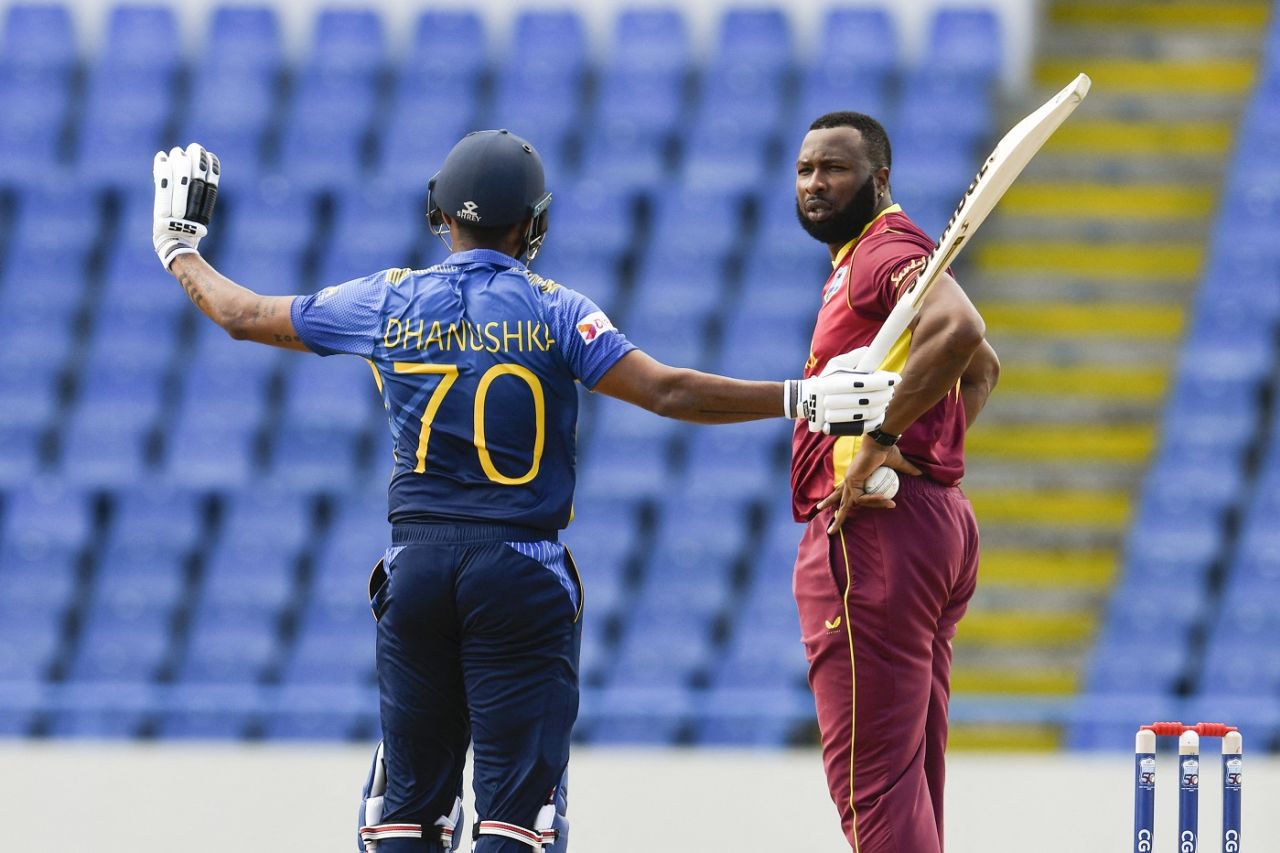 Danushka Gunathilaka gestures to Kieron Pollard that he didn't kick the ball away intentionally, West Indies vs Sri Lanka, 1st ODI, North Sound, March 10, 2021
