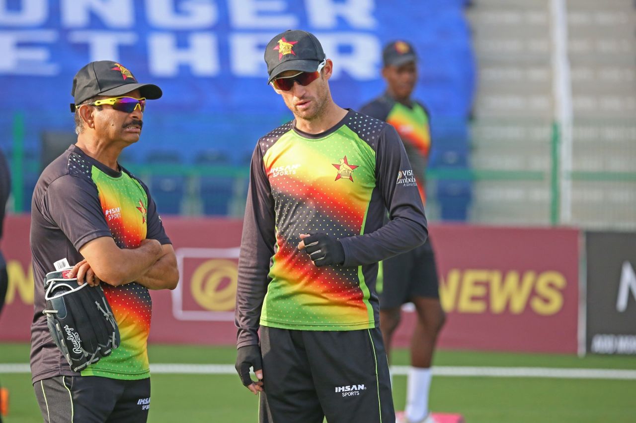 Captain Sean Williams and coach Lalchand Rajput have a chat, Afghanistan v Zimbabwe, 2nd Test, 2nd day, Abu Dhabi, March 11, 2021