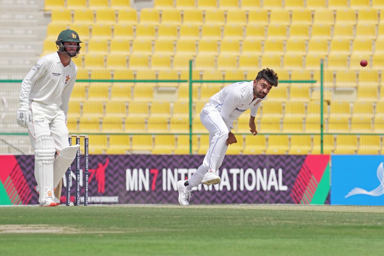 Rashid Khan bowls as Sean Williams looks on, Afghanistan vs Zimbabwe, 2nd Test, Abu Dhabi, 3rd day, March 12, 2021