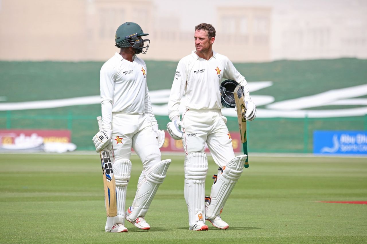 Donald Tiripano and Sean Williams have a chat while walking off the field, Afghanistan vs Zimbabwe, 2nd Test, Abu Dhabi, 4th day, March 13, 2021