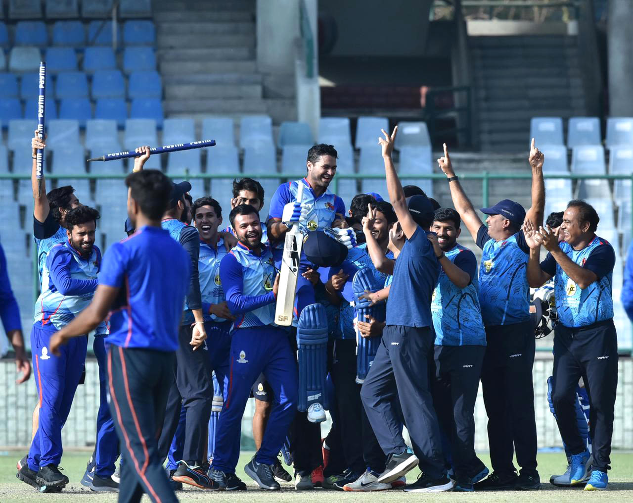 Aditya Tare is chaired off the field by his team-mates after scoring a match-winning century in the final, Delhi, March 14, 2021