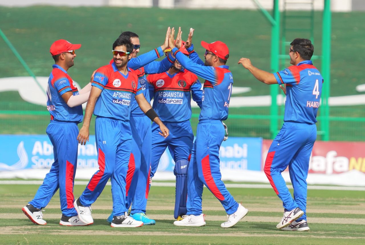 The Afghanistan players celebrate a wicket, Afghanistan vs Zimbabwe, 2nd T20I, Abu Dhabi, March 19, 2021