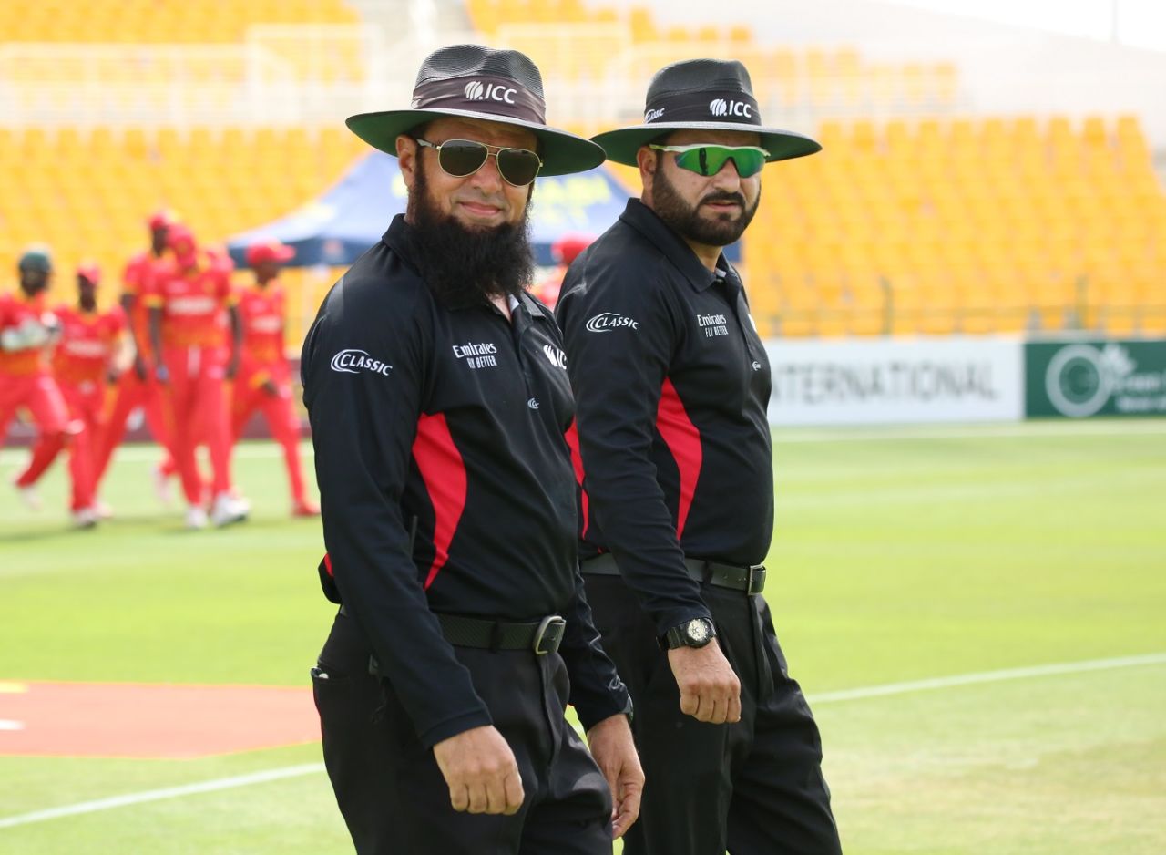 Aleem Dar, in his 400th international match as on-field umpire, and Ahmed Shah Pakteen walk out, Afghanistan vs Zimbabwe, 3rd T20I, Abu Dhabi, March 20, 202