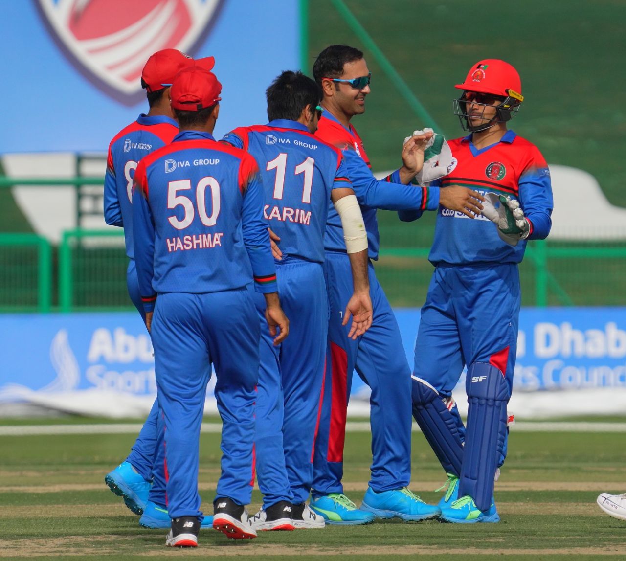 Mohammad Nabi celebrates a wicket with his team-mates, Afghanistan vs Zimbabwe, 3rd T20I, Abu Dhabi, March 20, 2021