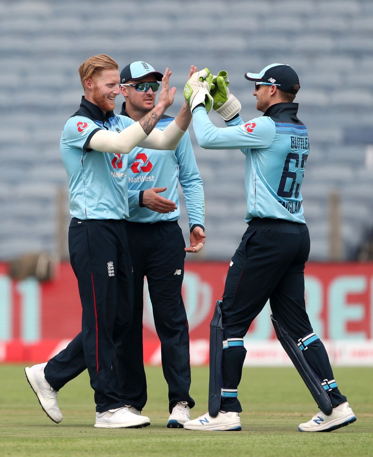 Ben Stokes celebrates a wicket with Jason Roy and Jos Buttler, India vs England, 1st ODI, Pune, March 23, 2021