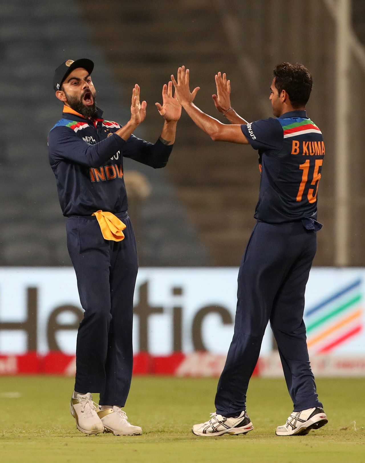 Virat Kohli and Bhuvneshwar Kumar celebrate a wicket, India vs England, 1st ODI, Pune, March 23, 2021