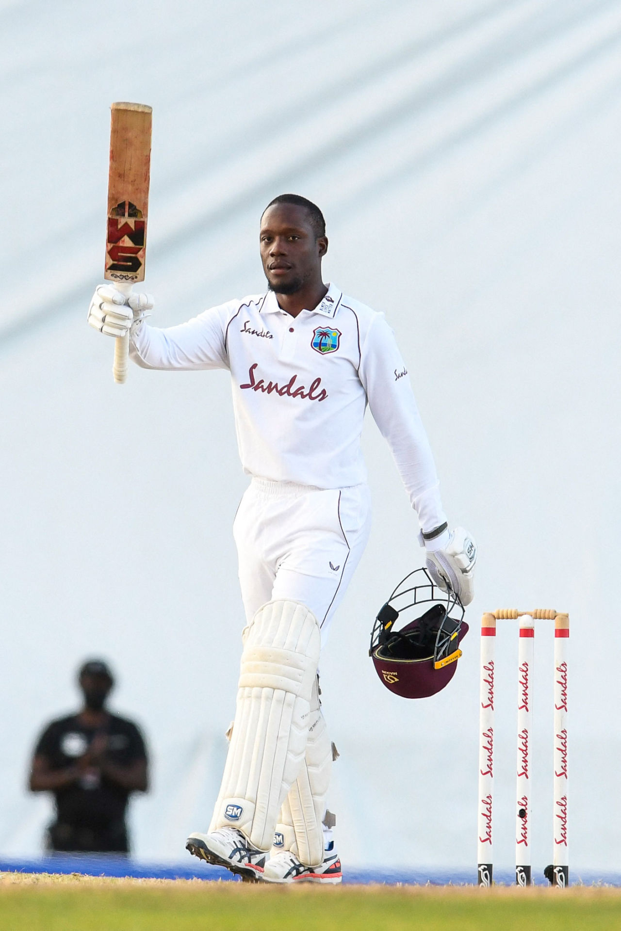Nkrumah Bonner raises his bat after reaching his maiden Test century, West Indies v Sri Lanka, 1st Test, North Sound, 5th day, March 25, 2021

