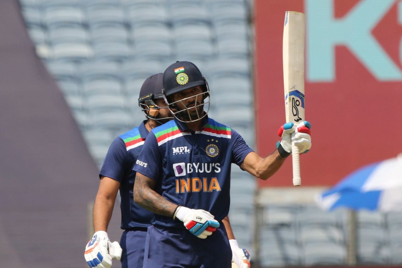 Shikhar Dhawan raises his bat after getting to his half-century, India vs England, 3rd ODI, Pune, March 28, 2021