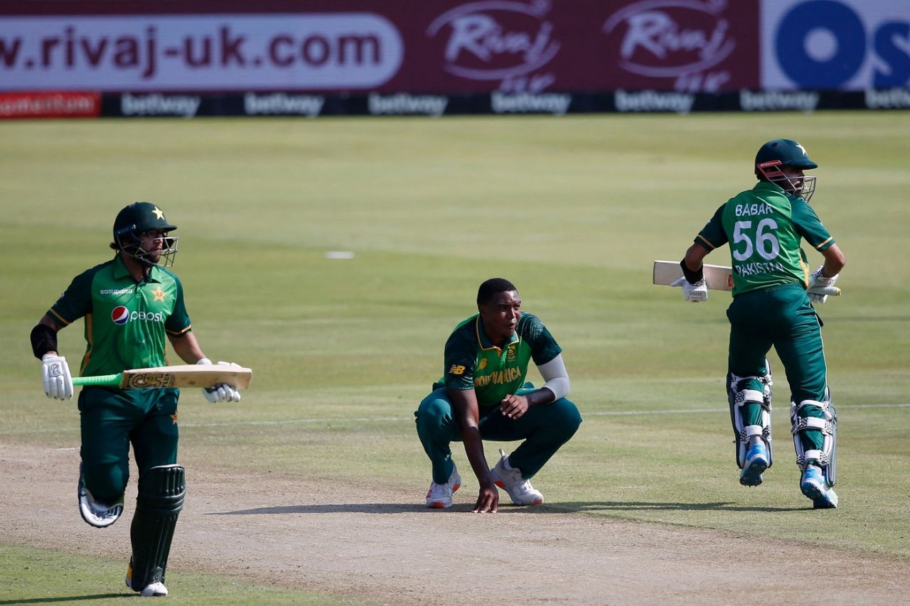 Imam-ul-Haq and Babar Azam run between the wickets as Lungi Ngidi, down on his haunches, looks on, South Africa vs Pakistan, 1st ODI, Centurion, April 2, 2021