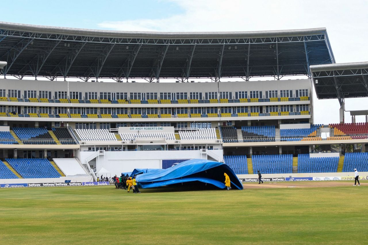 Groundstaff at North Sound remove the covers after a rain break, West Indies v Sri Lanka, 2nd Test, North Sound, 5th day, April 2, 2021