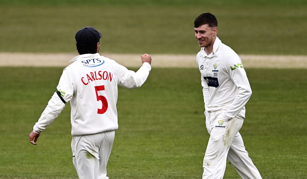 Callum Taylor keeps his hands in his pockets while celebrating a wicket with fielder Kiran Carlson, Yorkshire vs Glamorgan, County Championship, Headingley, April 9, 2021