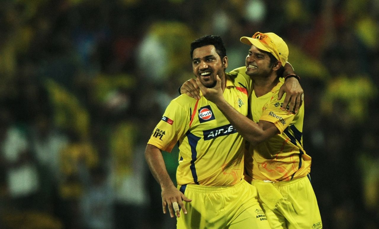 Shadab Jakati and Suresh Raina celebrate a wicket, Chennai, May 28, 2011