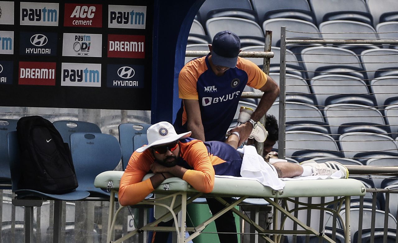 India physio Nitin Patel attends to Rohit Sharma, Pune, March 22, 2021