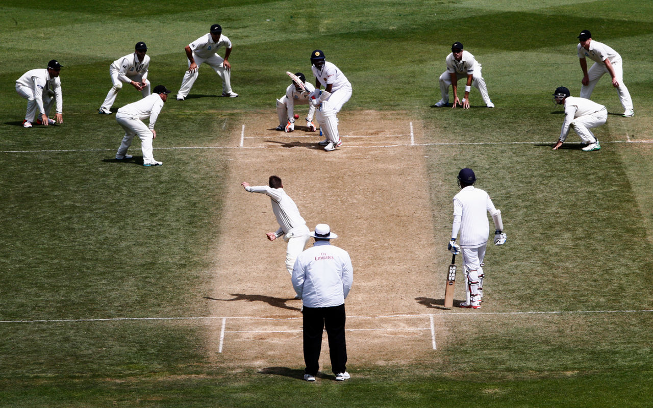 Close-in fielders surround the pitch as Mark Craig bowls, New Zealand v Sri Lanka, 2nd Test, Wellington, 5th day, January 7, 2015