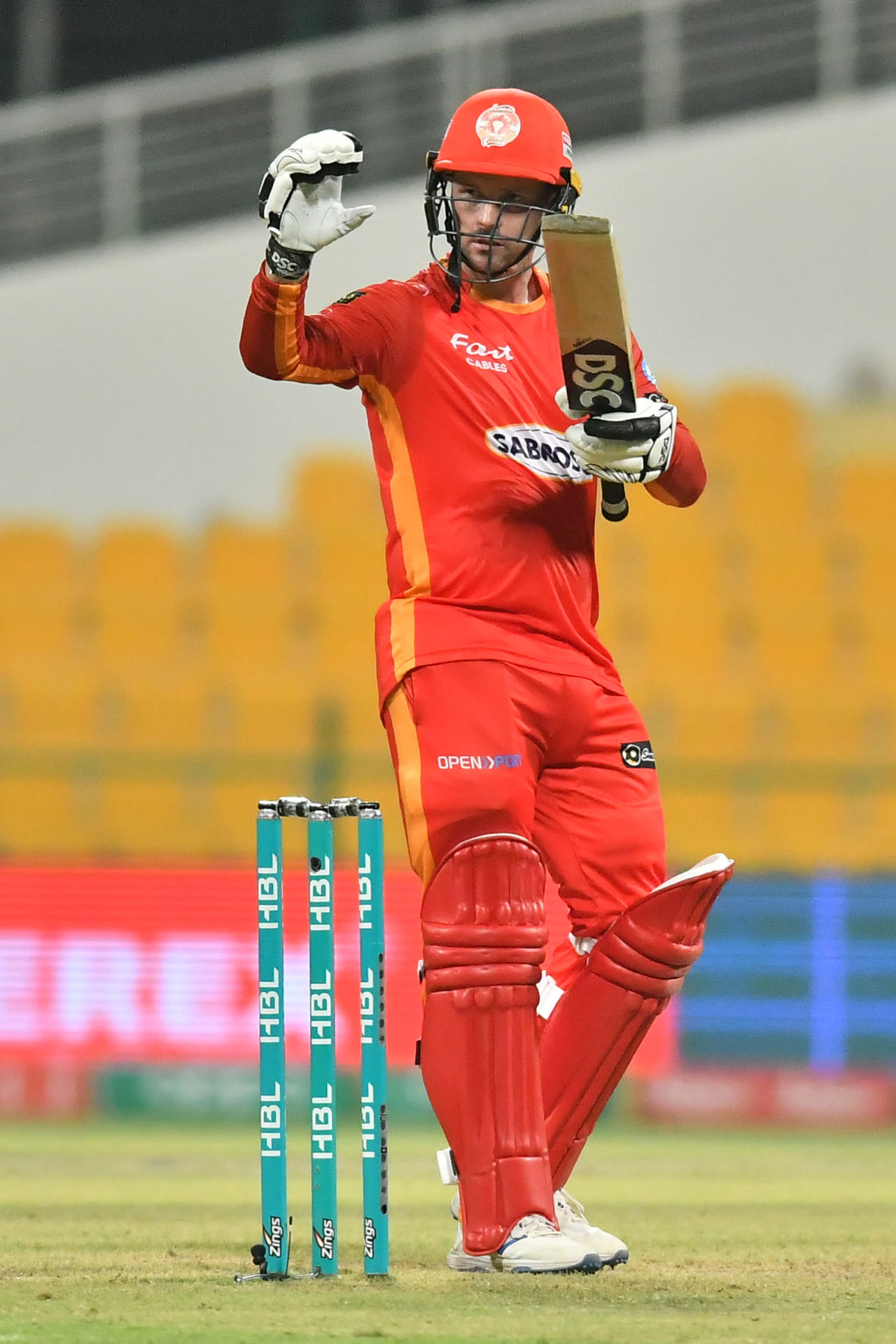 Colin Munro holds up a sign for his kids after reaching a half-century, Islamabad United vs Karachi Kings, PSL 2021, June 15, 2021