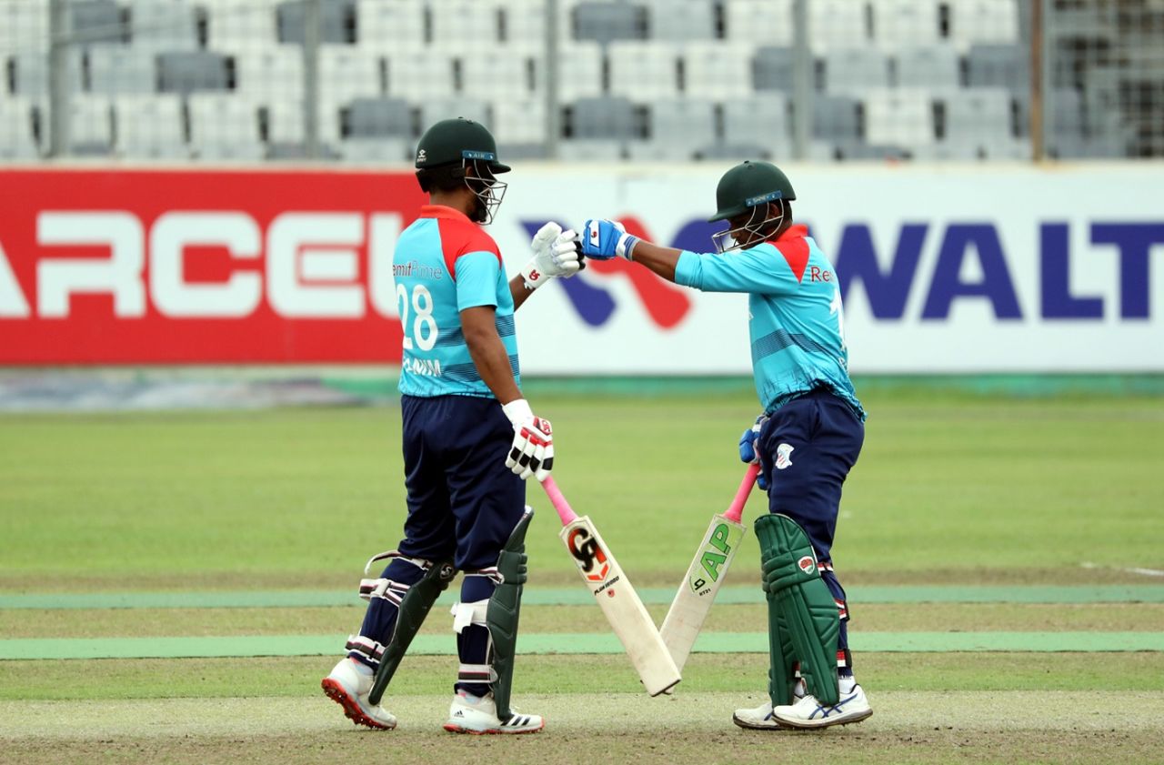 Tamim and Rony Talukdar of Prime Bank bump gloves, Dhaka, June 17, 2021