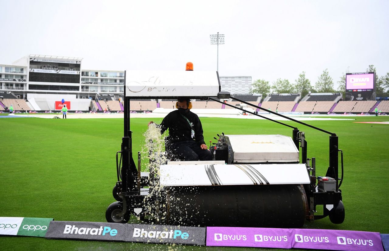 A member of the groundstaff emptyies water from the ground, India vs New Zealand, WTC final, Southampton, 1st day, June 18, 2021