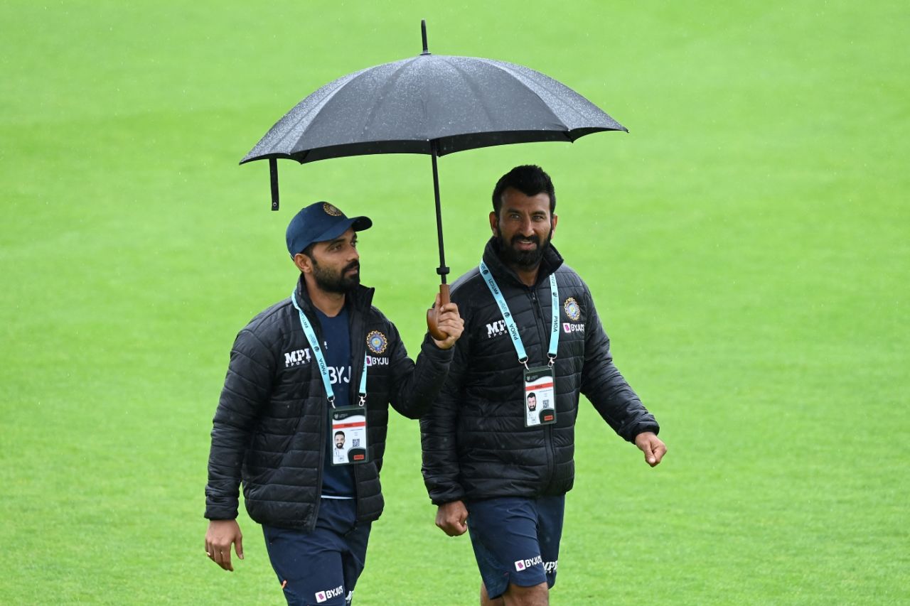 Not quite a stroll in the park: Ajinkya Rahane and Cheteshwar Pujara make their way across a wet Rose Bowl, India vs New Zealand, World Test Championship (WTC) final, 4th day, Southampton, June 21, 2021