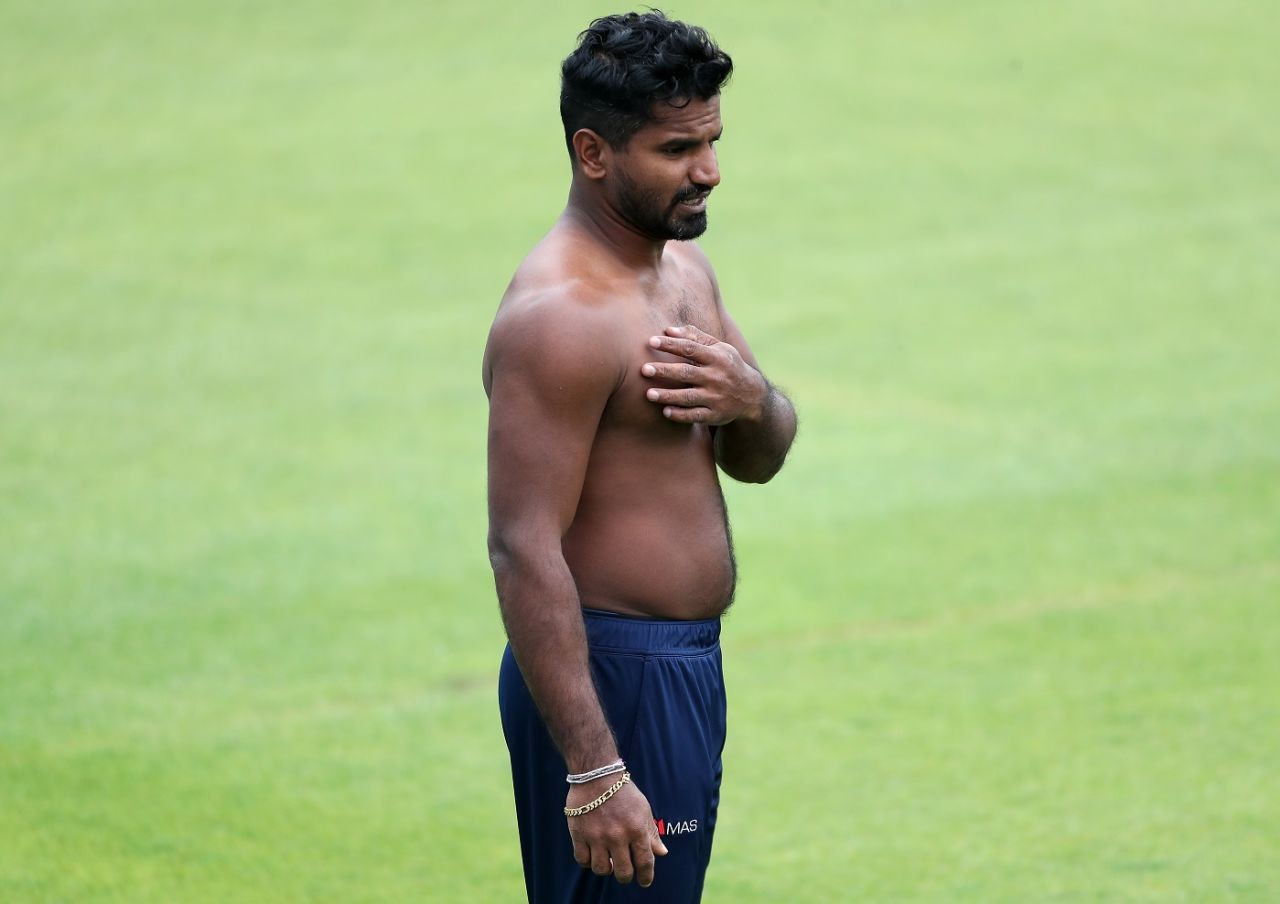 A shirtless Kusal Perera looks on during a training session, Cardiff, June 21, 2021