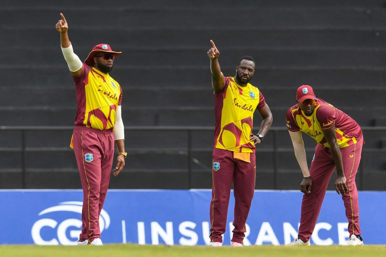 Kieron Pollard and Andre Russell set field as Jason Holder looks on, West Indies vs South Africa, 1st T20I, St George's, June 26, 2021