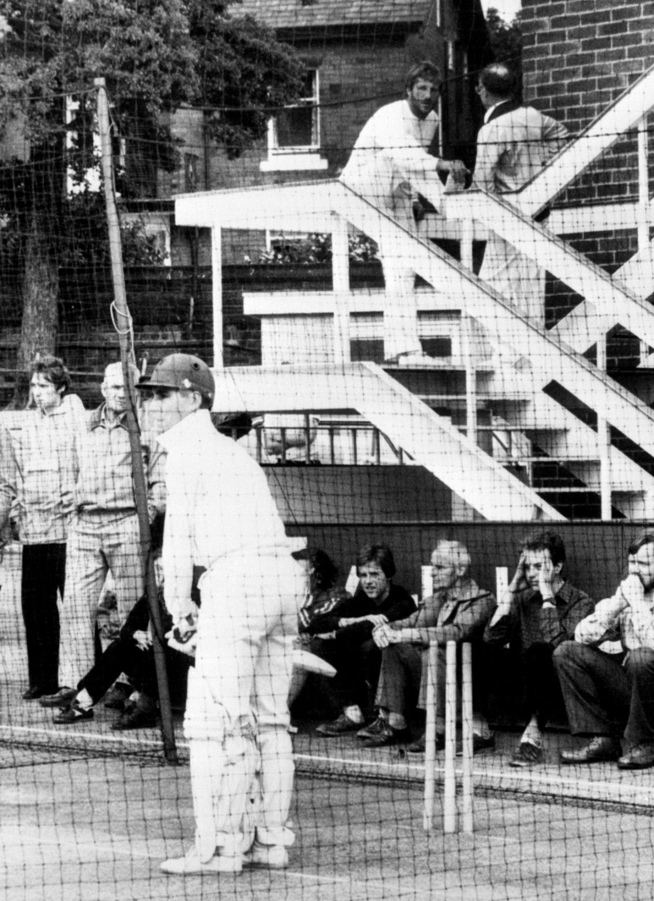 New England captain Mike Brearley bats in the nets while his predecessor, Ian Botham, chats with an acquaintance, Headingley, July 15, 1981