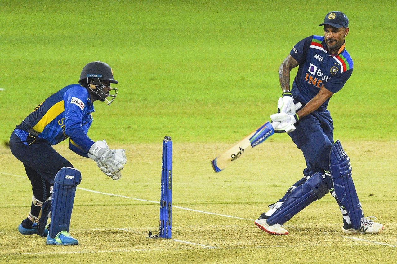 Shikhar Dhawan tries to sweep as Minod Bhanuka looks on, India vs Sri Lanka, 1st ODI, Colombo, July 18, 2021